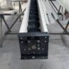 ADDAMS U-trough screw conveyor showing helical flight, shaft and end bearing