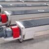 ADDAMS enclosed screw conveyors with red drive guards and geared motors