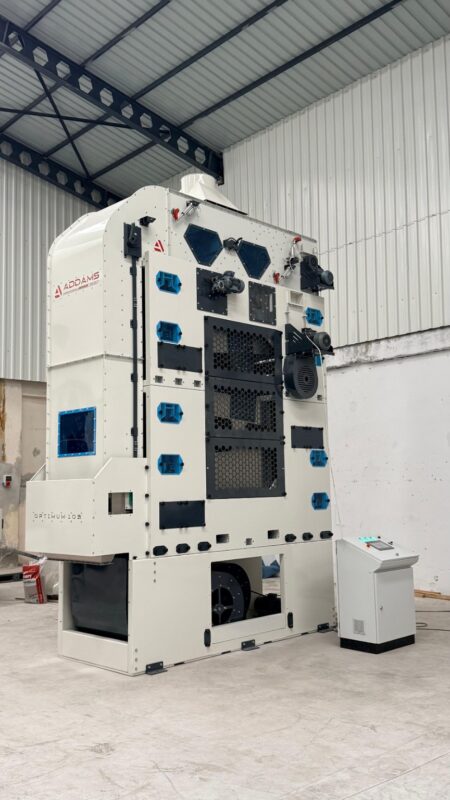 ADDAMS Optimum 103 seed cleaning machine with its control panel in the workshop